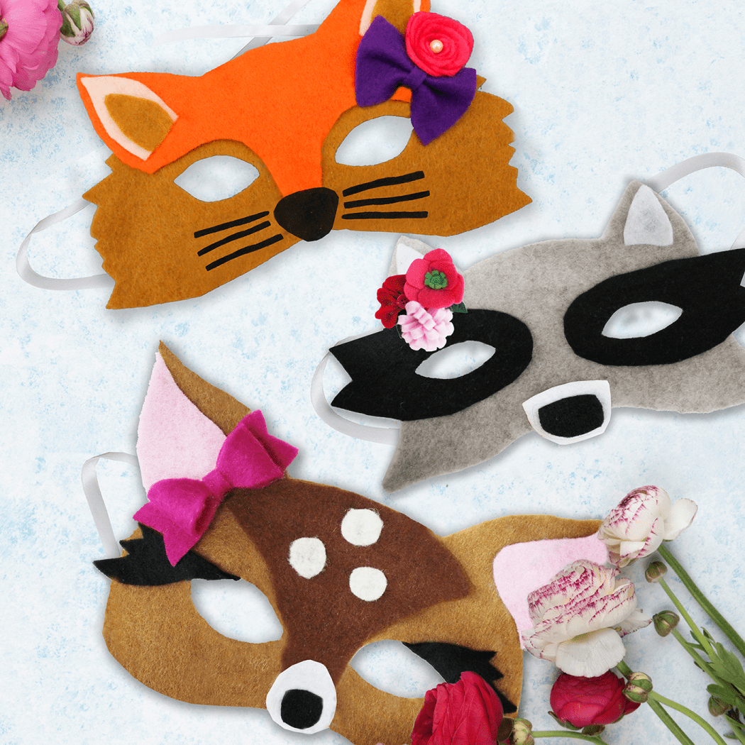 Closeup of deer, fox and raccoon masks